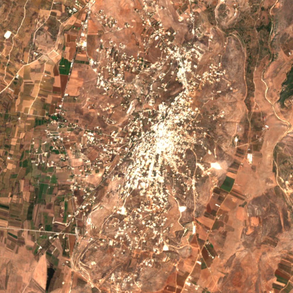 Sentinel-2 true-colour view, 5 km across, of the town of Khiam on 11 September 2025: a pale, dense built-up core on a ridge, with scattered settlement to the north, among brown and green fields and rocky hillsides.